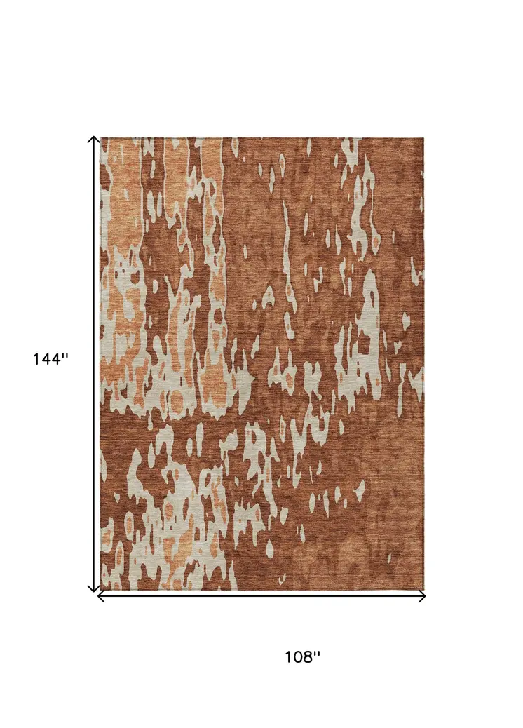 9' X 12' Orange And Ivory Abstract Washable Indoor Outdoor Area Rug