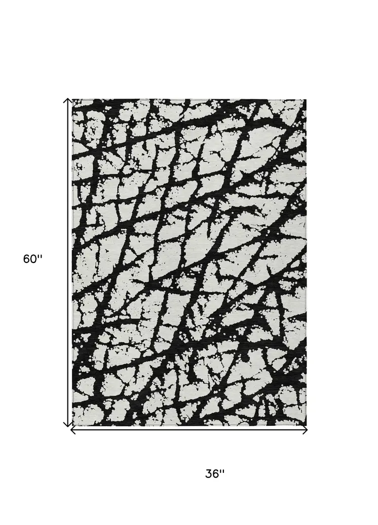 3' X 5' Black And Ivory Abstract Washable Indoor Outdoor Area Rug