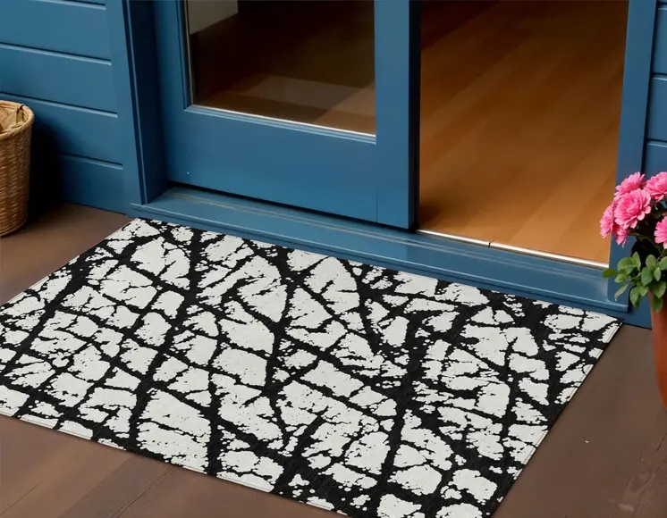 3' X 5' Black And Ivory Abstract Washable Indoor Outdoor Area Rug