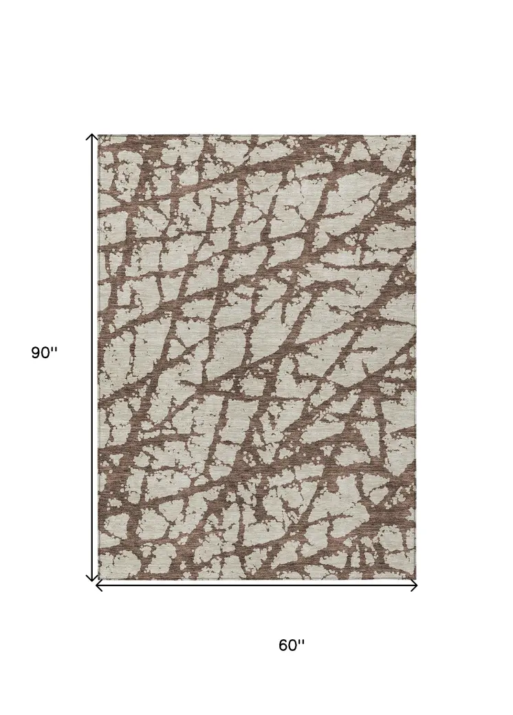 5' X 8' Brown And Ivory Abstract Washable Indoor Outdoor Area Rug