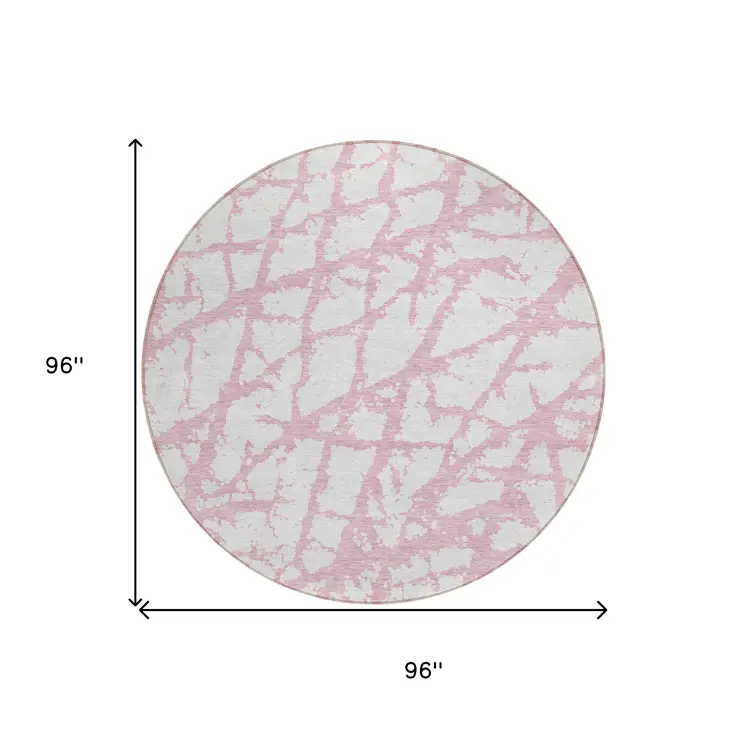 8' Pink And Ivory Round Abstract Washable Indoor Outdoor Area Rug