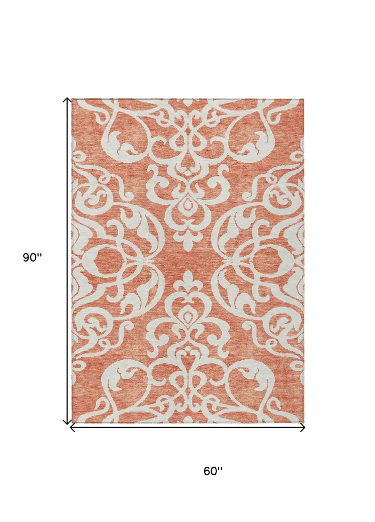 5' X 8' Coral And Ivory Damask Washable Indoor Outdoor Area Rug
