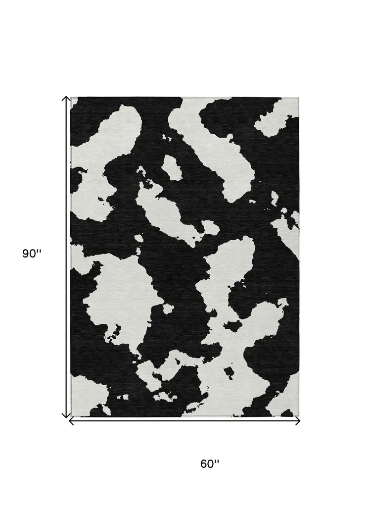 5' X 8' Black And Ivory Abstract Washable Indoor Outdoor Area Rug