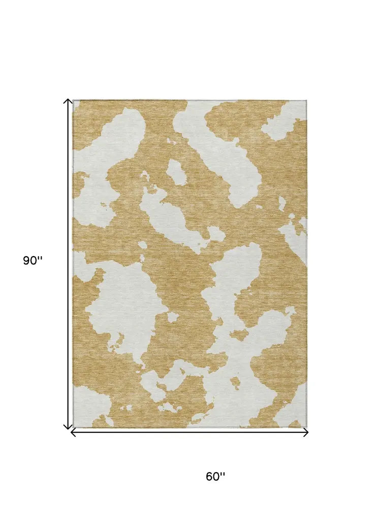 5' X 8' Gold And Ivory Abstract Washable Indoor Outdoor Area Rug