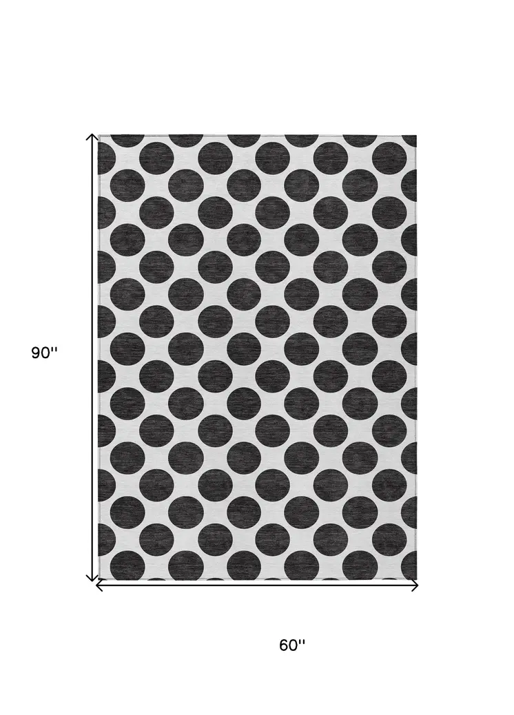5' X 8' Black And Ivory Polka Dot Washable Indoor Outdoor Area Rug