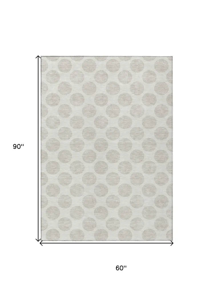 5' X 8' Ivory And Beige Polka Dot Washable Indoor Outdoor Area Rug