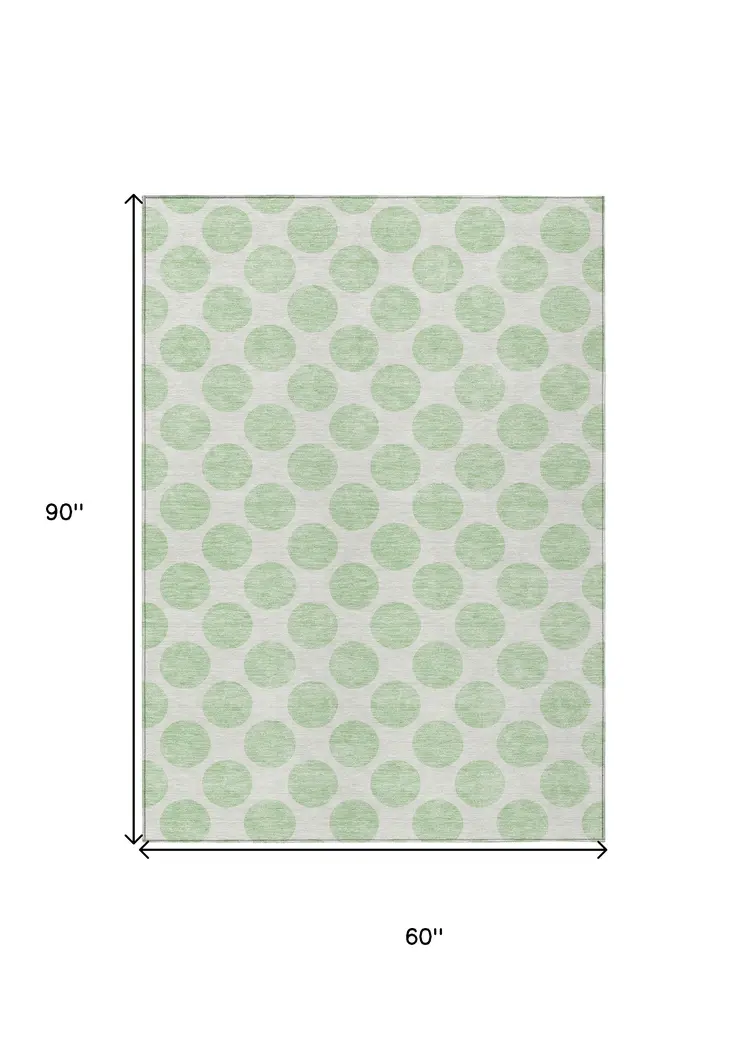 5' X 8' Mint Green And Ivory Polka Dot Washable Indoor Outdoor Area Rug