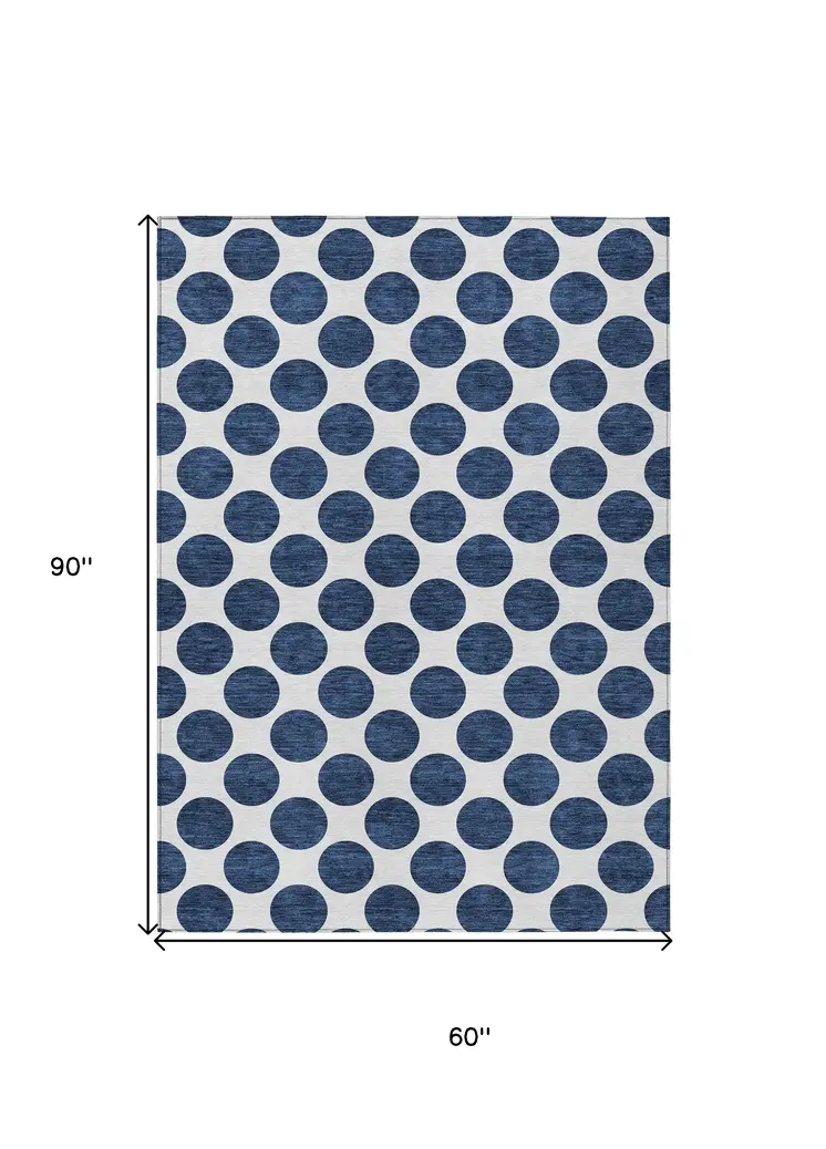5' X 8' Navy Blue And Ivory Polka Dot Washable Indoor Outdoor Area Rug