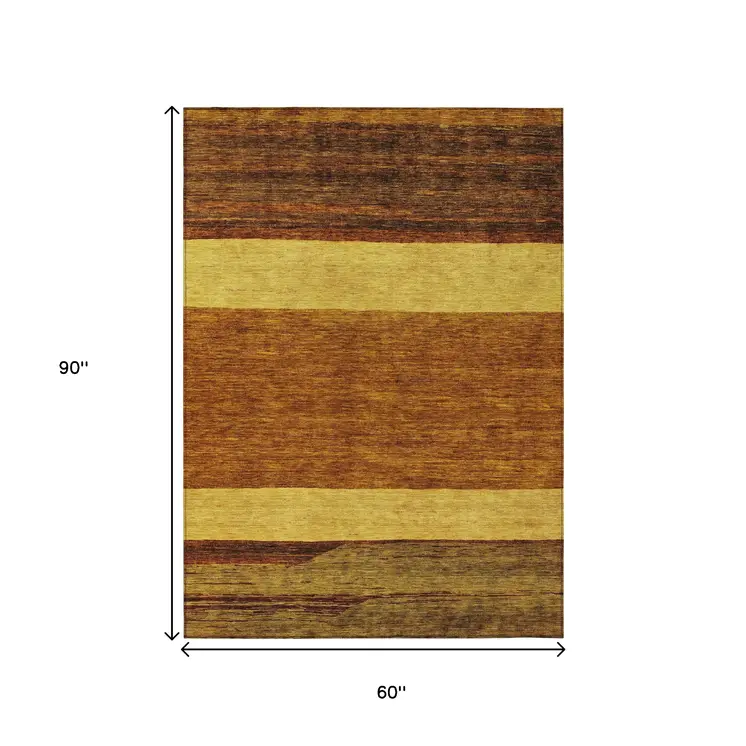 5' X 8' Terra Cotta Gold And Brown Abstract Washable Indoor Outdoor Area Rug