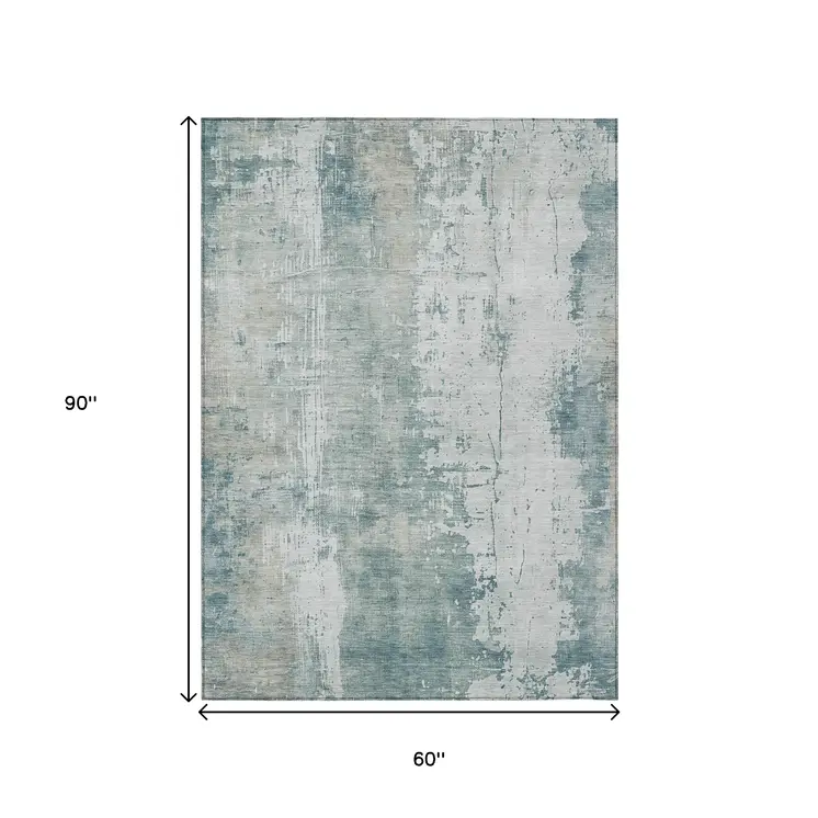 5' X 8' Turquoise And Ivory Abstract Washable Indoor Outdoor Area Rug