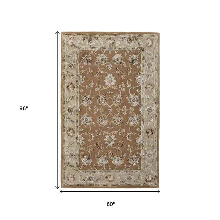 5' X 8' Tan And Ivory Floral Hand Tufted Area Rug