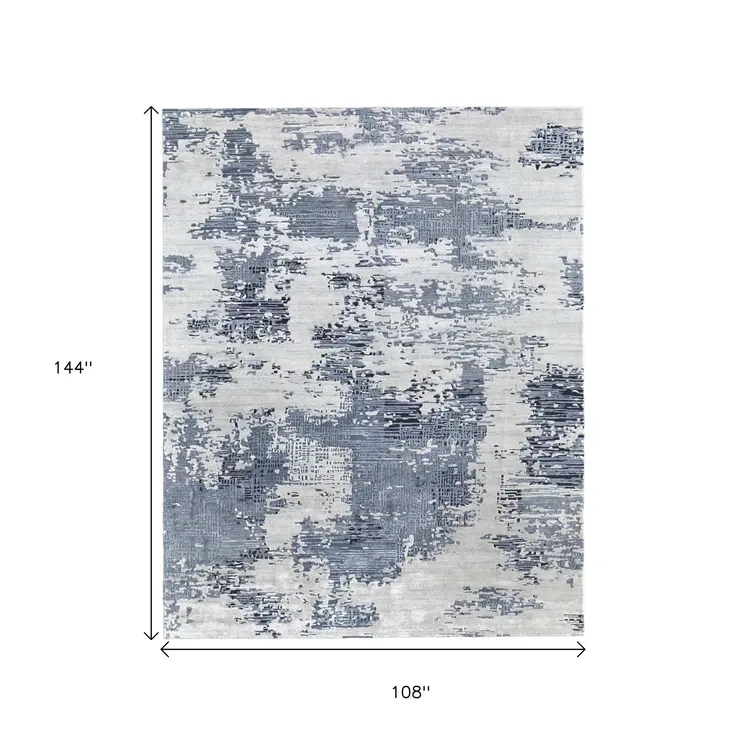 9' X 12' Blue And Ivory Abstract Hand Tufted Area Rug