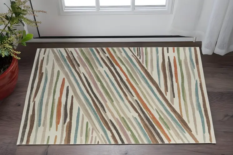 2' X 3' Ivory Brown And Blue Abstract Area Rug