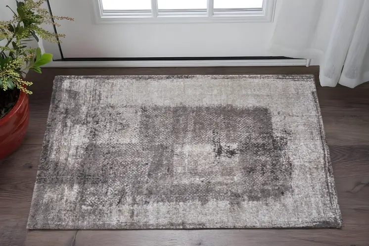 2' X 3' Gray Black And Taupe Abstract Distressed Area Rug