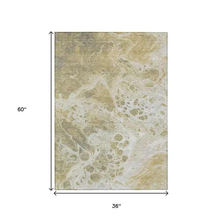 3' X 5' Gold And Ivory Abstract Washable Indoor Outdoor Area Rug