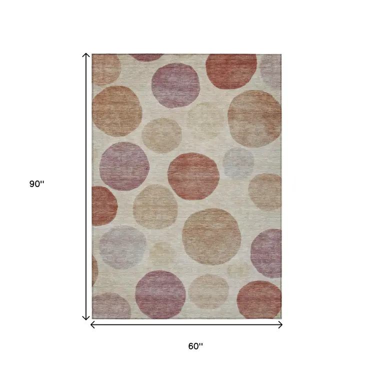 5' X 8' Salmon Ivory And Mauve Geometric Washable Indoor Outdoor Area Rug