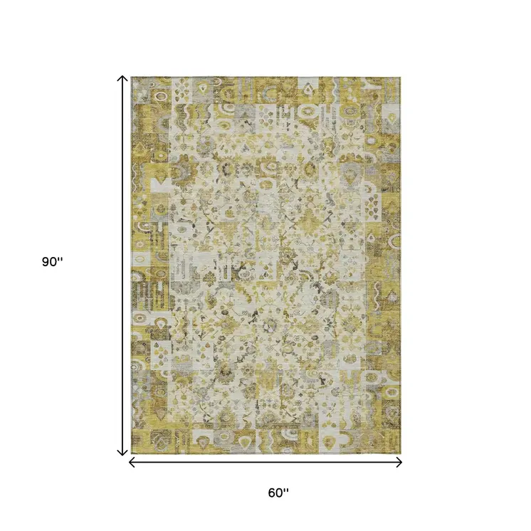 5' X 8' Gold And Ivory Patchwork Washable Indoor Outdoor Area Rug