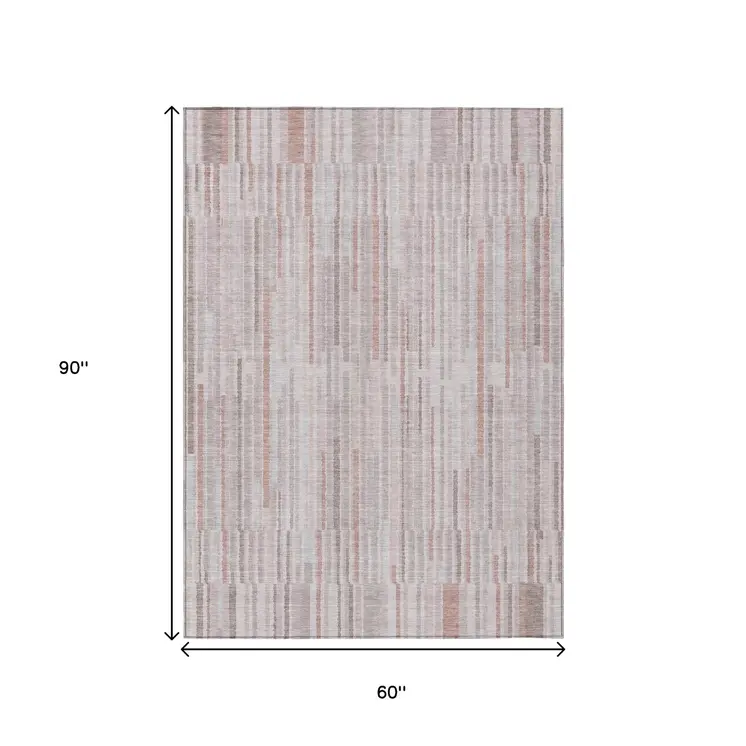 5' X 8' Coral And Beige Striped Washable Indoor Outdoor Area Rug