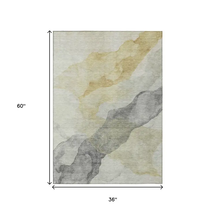 3' X 5' Beige And Gold Abstract Washable Indoor Outdoor Area Rug
