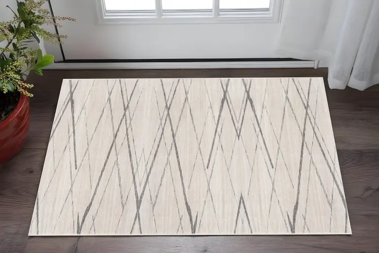 2' X 5' Beige And Gray Abstract Area Rug
