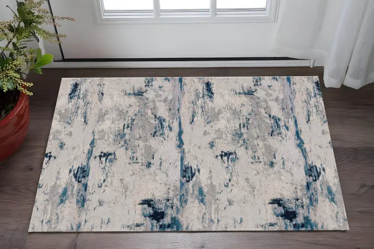 2' X 5' Blue And Cream Abstract Area Rug