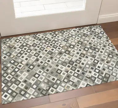 2' X 3' Black Gray And White Faux Cowhide Geometric Area Rug