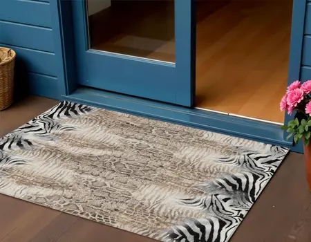 3' X 5' Ivory Black And Beige Animal Print Washable Indoor Outdoor Area Rug